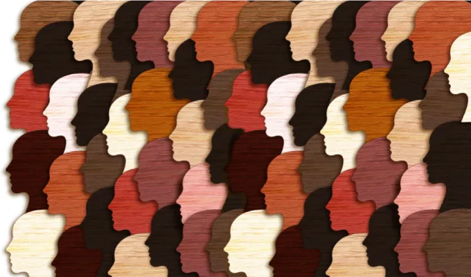 Illustration of silhouettes of rows of many heads, all facing to the left. The heads represent main skin colors, including white, tan, brown, and black. 