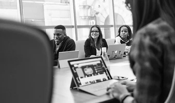 Photo of diverse staff at a meeting. Photo by christina@wocintechchat.com on Unsplash