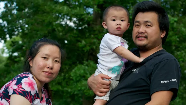 Photo of Asian couple with toddler