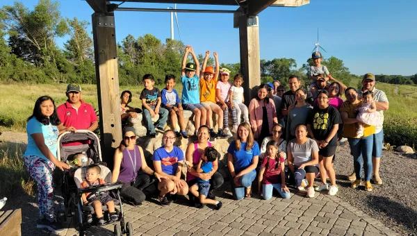 Group photo of families from the Morris, MN area enjoying an outing put on by Conexiones.